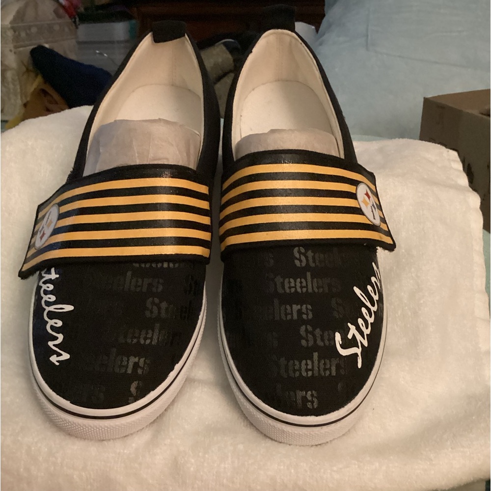 Selling one Pair of Ladies Pittsburgh Steelers Sneakers. Size 6 1/2”m.